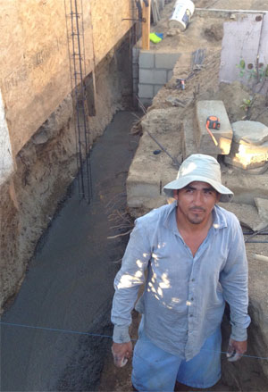 Marco Razo is standing on the foundations of his future home